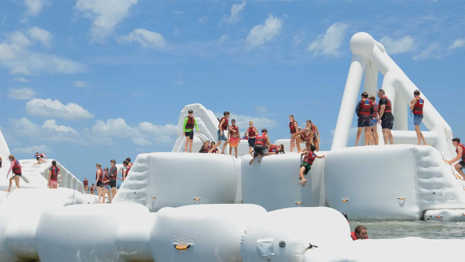 Aqua Warrior group taking on the floating obstacle course together